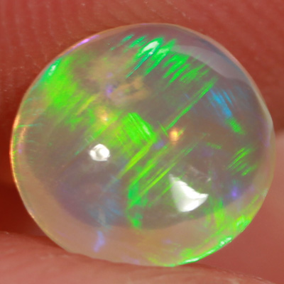 SOLID CRYSTAL OPAL Linear Rolling flashes of green fire